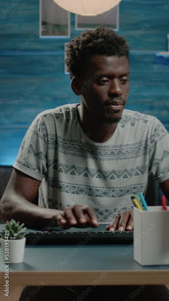 Poster vertical video: businessman working from home with computer in workspace. corporate worker doing onl