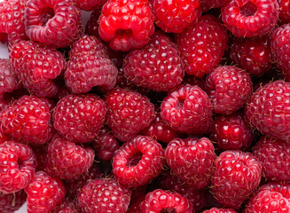 Ripe raspberries background. Fresh fruit closeup. Sweet berries