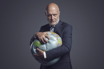 Greedy corporate businessman crushing and exploiting earth