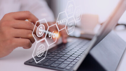 Busines using a computer to complete Individual income tax return form online for tax payment....