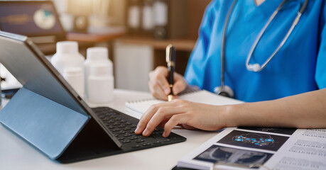 Medical technology concept. Doctor working with tablet keyboard mobile phone and stethoscope