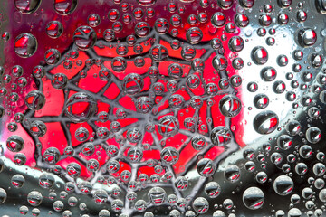 Striped spheres are located against the purple-red background with gray web silhouette. Space abstraction. 3D render. 