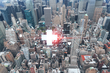 Aerial panoramic roof top city view of New York City Financial Downtown district, day time. Manhattan, NYC, USA. Health care digital medicine hologram. The concept of treatment and disease prevention