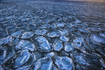 freezing sea ice round pieces, ocean background winter climate coast