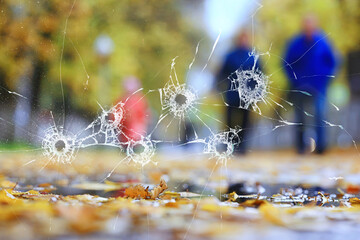 abstract simulation blurred view of the city bullet holes on the window glass, shooting war background attack
