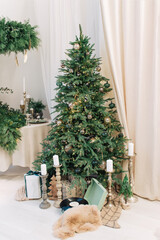 Christmas background,  pine branches festive background. Creative composition with border and copy space. Christmas decoration with bokeh lights from light bulbs