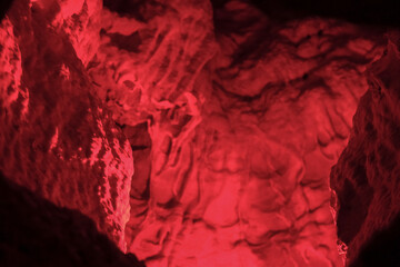 Magic and mystical lighting inside Cave of the Winds stalactite cavity hollow attraction near...