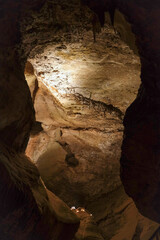 Magic and mystical lighting inside Cave of the Winds stalactite cavity hollow attraction near...
