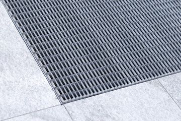 Floor drainage and anti-slip metal grate at the entrance to the building. Drain gratings. Drainage...