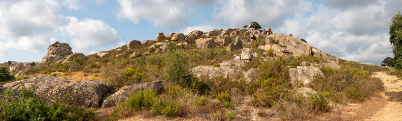 Beautiful panoramic view of the rock formations of the Los Alcornocales Natural Park, located on the Ruta del Toro, near the town of Los Barrios, in the Andalusian province of Cadiz, Spain.