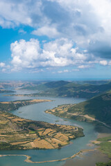 Fototapeta premium top view of river view through mountains with sky