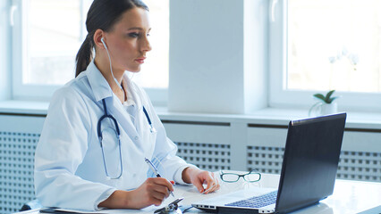 Professional medical doctors working in hospital office making conference call. Medicine, healthcare and online consultation.