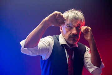 Caucasian Business Man in waistcoat suit standing in a fight stance in guard ready to hit the...
