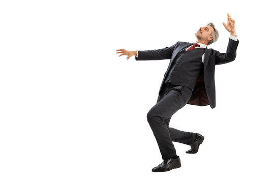 Full length portrait of Businessman in blue suit stands with his back deeply bent backwards. isolated on white background with copy space.