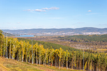 "Sunny valley" ski resort. Autumn landscape from the top of the mountain on Miass city. South Ural, Chelyabinsk region, Russia