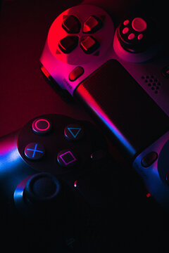 M&Aacute;LAGA -  SPAIN - FEBRUARY 16, 2020: Playstation 4 Gamepad on black background with color lights. Sony PS4 Dualshock V2. Studio Shot.