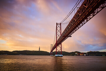 Fototapeta na wymiar April 25th Bridge in Lisbona, Portugal, at sunrise