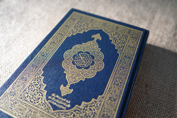 Fototapeta premium The Quran, also romanized Qur'an or Koran, is the central religious text of Islam, believed by Muslims to be a revelation from God (Allah).It is widely regarded as the finest work in classical Arabic
