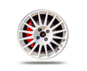 Car wheels on a white background behind a cutting machine separa