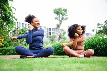 Yoga outdoor in the park. Young woman doing yoga exercise outdoor at the day time with fresh air in the garden. Sport and exercise concept