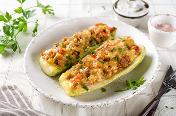 Zucchini stuffed with minced meat and tomatoes and cheese.