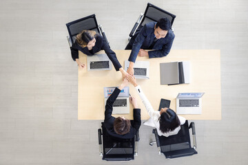 Group of young colleague businessman and businesswoman celebrate successful together in working office, Hands join together teamwork concept