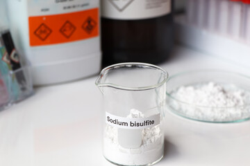 sodium bisulfite powder in glass, chemical in the laboratory