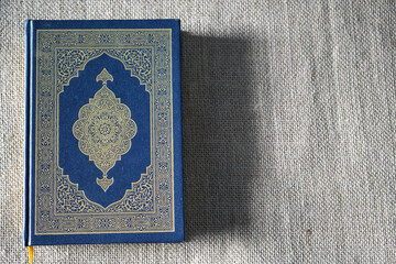 Indonesia - July, 2022 : The Quran, also romanized Qur'an or Koran, is central religious text of...