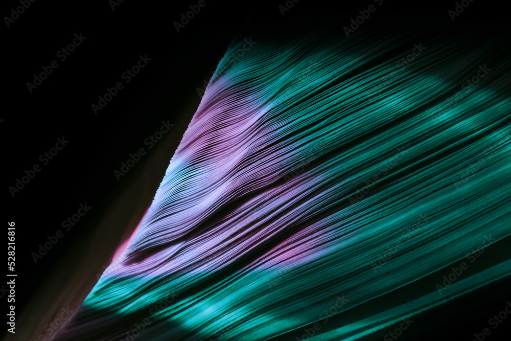 Leinwandbilder close up beautiful book pages in the multi color light on a night. background pattern for design. ma