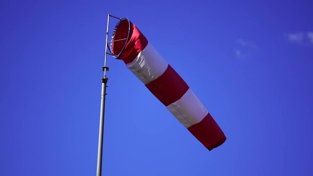 Windsock in the blue sky - slow motion