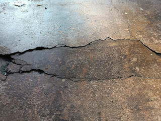 Cracked concrete ground broken at floor home or street road subside from earthquake_2
