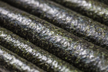 Japanese sushi rolls together diagonally - close up