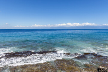 Sea wave splash over the rock
