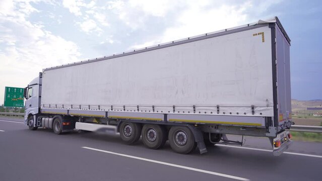 A truck on the highway. Logistics.
The transport truck is driving on the highway.
