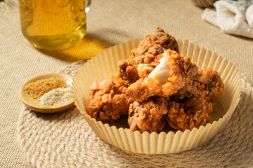 Fresh fried chicken legs on a simple background