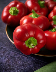 red bell peppers on black background