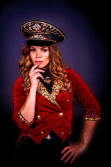 Portrait woman magician illusionist circus in theatrical clothes deep thinking at black background....