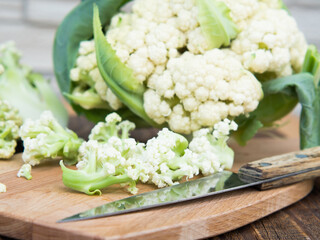 Organic cauliflower on a wooden table close up