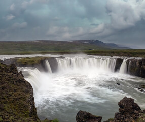 Goðafoss waterfall in northern Iceland, located along the country's main ring road. The water of the river Skjálfandafljót falls from a height of 12 metres over a width of 30 metres.