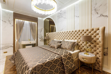 luxury hotel bedroom. Bed with carriage coupler headboard