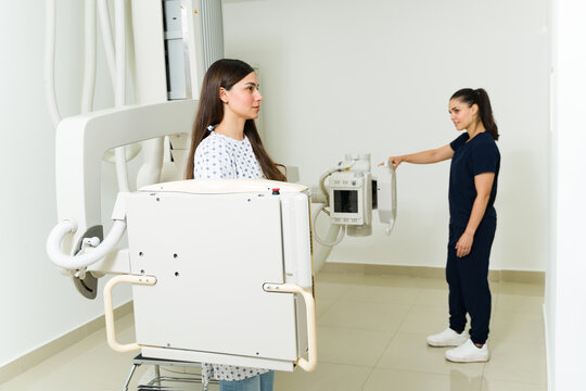 Caucasian female radiologist getting an x-ray image at the diagnostic lab