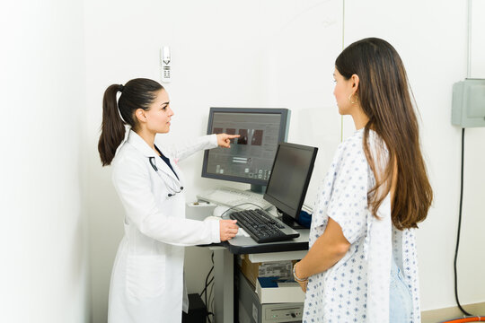 Doctor giving a diagnosis to a woman after getting a breast mammogram