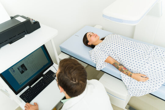 Hispanic Patient Getting A Diagnosis With A Densitometry X-ray Test