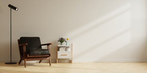Modern minimalist interior with a black leather armchair on empty white wall background.