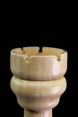 close-up wooden chess piece on black background