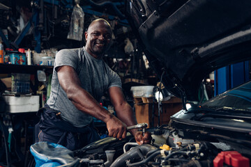 Auto mechanic are repair and maintenance auto engine is problems at car repair shop.	