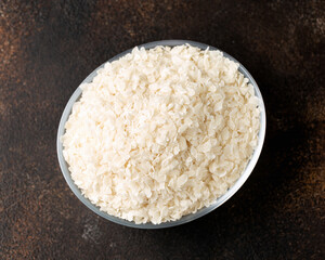 Gluten free Rice flake porridge in a glass bowl
