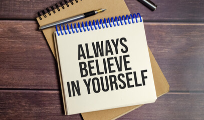 aLWAYS BELIEVE IN YOURSELF text on wooden background