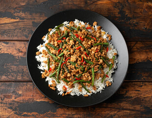 Pork Stir Fry with Green Beans, rice, garlic, chili and ginger. Asian food.