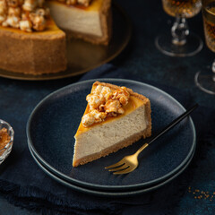 slice of cheesecake with popcorn and salted caramel sauce